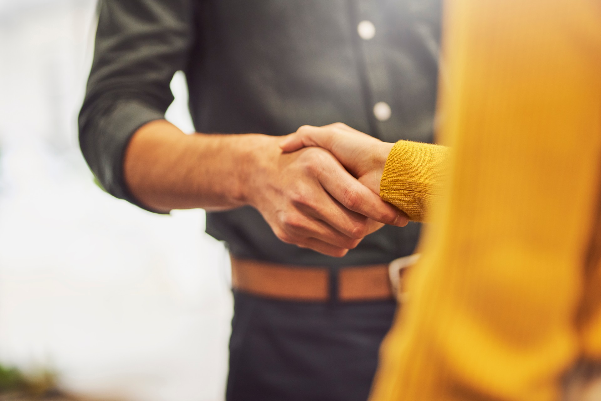 Businessman shaking hands with female colleague